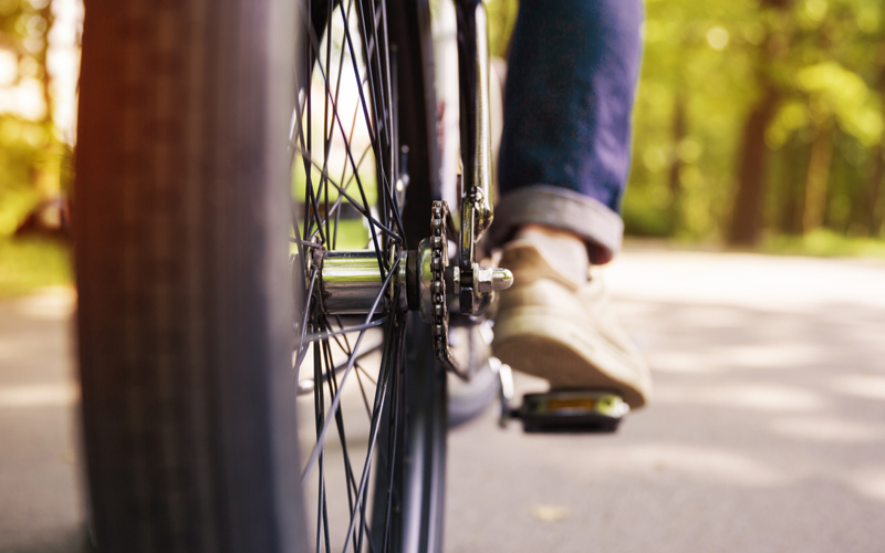 bigstock Bicycle Wheel And Men Leg On P 174345838